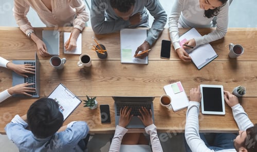Preview: Business team having morning briefing, top view