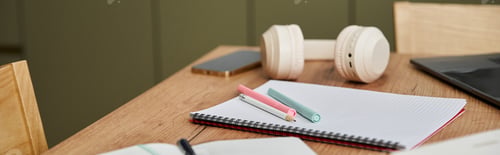 Preview: Creative space of a beautiful young woman at home with fitness and art supplies