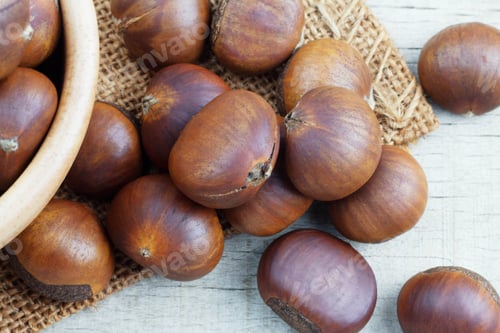 Preview: chestnuts on wooden floor
