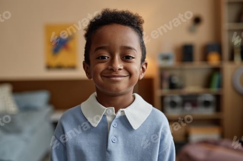 Preview: Smiling Preschool Black Boy Looking at Camera while Posing in Bedroom