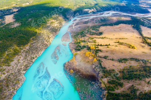 Preview: A drone view of the river in the mountains valley. An aerial view of an autumn forest.