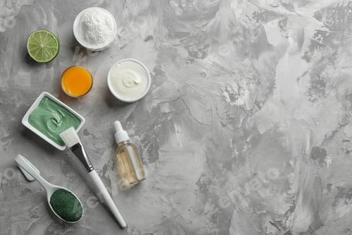 Vista previa: Flat lay composition with spirulina facial mask and ingredients on grey table. Space for text