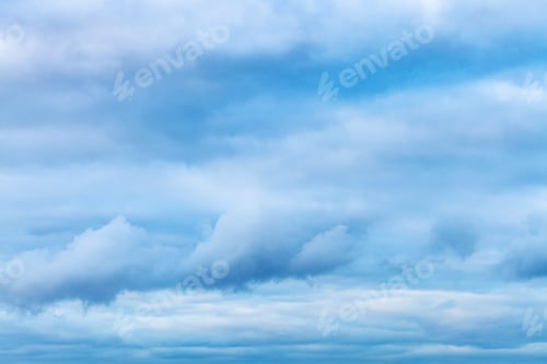 Preview: low dark blue clouds in spring evening sky
