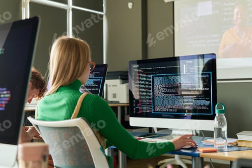 Preview: Girl Sitting at Desk with Computer