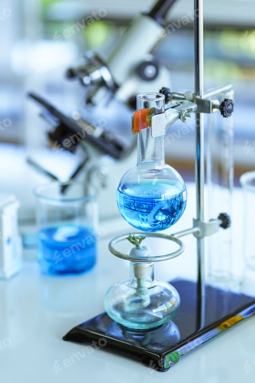 Preview: Chemical glassware with blue liquids on table in Laboratory, Equipment chemistry Science