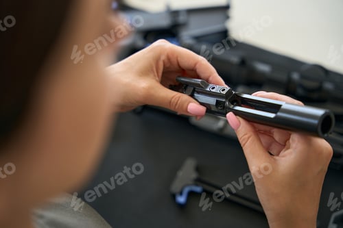 Preview: Woman holding a technical detail in her hands
