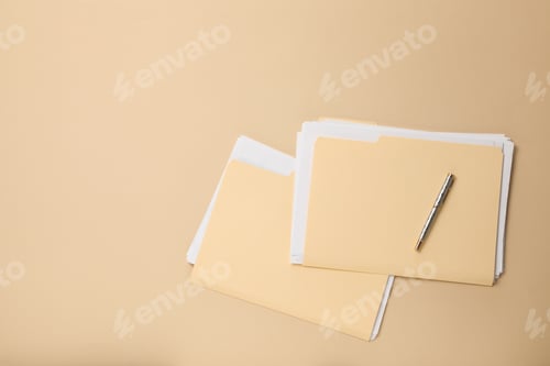 Preview: File folders with papers and pen on beige background, flat lay. Space for text