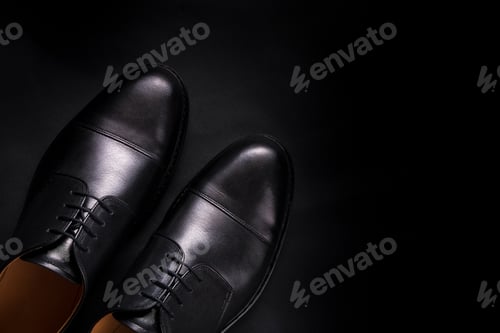 Preview: Black oxford shoes on background. Top view. Copy space.