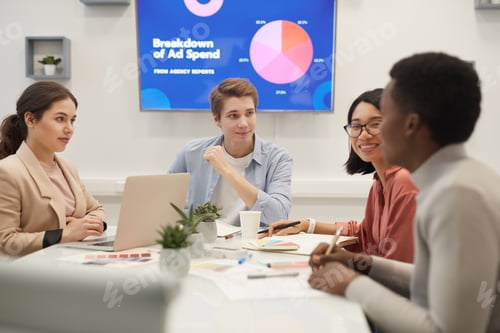 Preview: Young People Discussing Marketing in Meeting