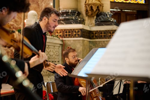 Preview: Musicians perform during an evening concert in a historic church setting