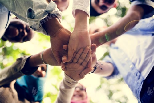Preview: Group of diverse youth with teamwork joined hands