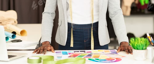 Preview: Unrecognizable Dressmaker Choosing Color Samples In Fashion Studio