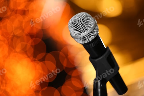 Preview: Microphone against festive lights, space for text. Musical equipment