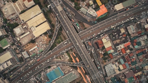 Preview: Top down of cross road traffic with cars, trucks, vehicles in aerial view. Downtown of Manila city