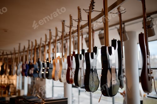 Preview: Selective focus on electric guitar rack at modern musical showroom