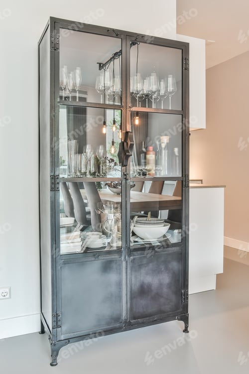 Black and Glass Cabinet Displaying Drinkware and Dishes