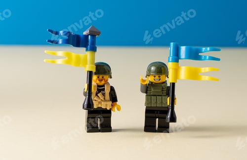 Preview: Lego little men with flags of Ukraine. A minifigure toy man holding a blue flag. Support of the