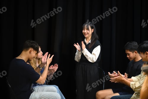 Preview: Diverse individuals in counseling session express appreciation and positive reinforcement.