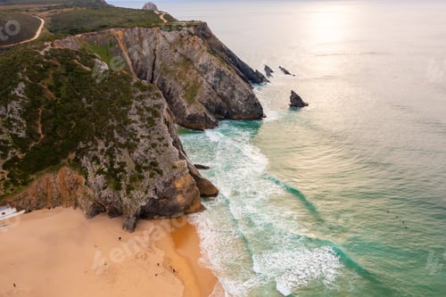 Preview: Aerial view of rocky cliff coastline with ocean waves