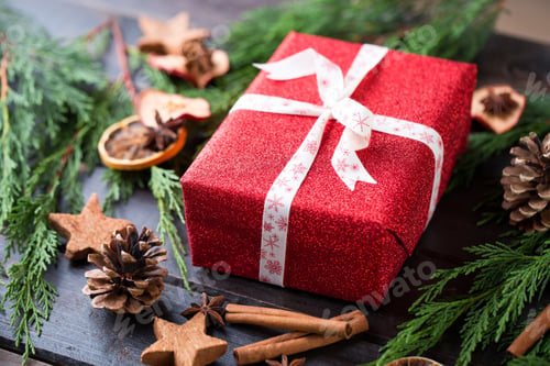Preview: Christmas gift on the antique wooden background.