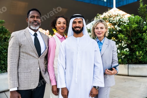 Preview: Group of multiethnic business people meeting an emirati businessman