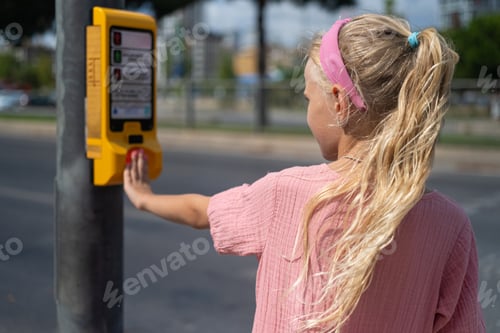 Preview: importance of kids learning traffic safety, girl pushes the crosswalk button on traffic lights