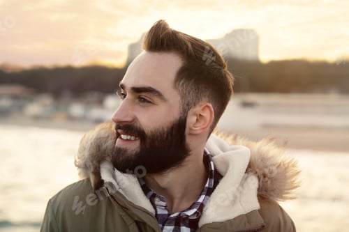 Preview: Portrait of stylish young man near sea
