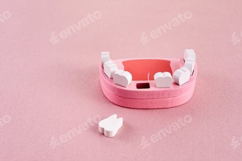 Preview: Teeth loss concept. Wooden jaw model with missing or extracted tooth