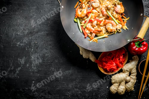 Preview: Chinese wok. Freshly cooked Udon noodles with ginger and soy sauce in bowls.