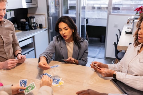 Preview: Business team playing cards in office breakroom, promoting teamwork and camaraderie