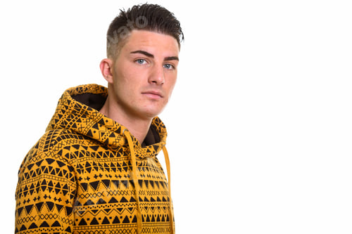 Preview: Studio shot of young handsome man looking at camera