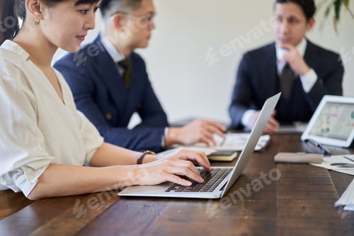 Preview: Asian female business woman recording meeting contents