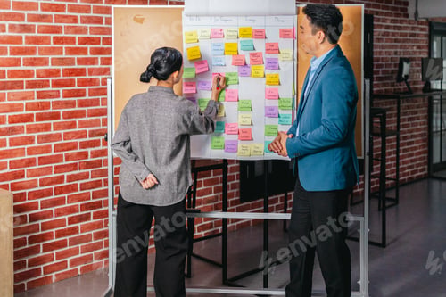 Preview: Professional Colleagues Brainstorming Ideas in a Modern Collaborative Workspace