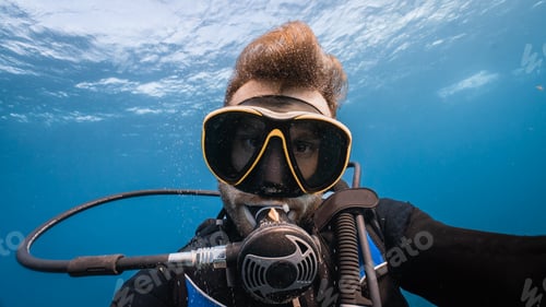 Preview: very close portrait of a diver underwater