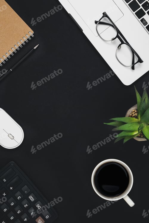 Preview: Flat lay black background with laptop, coffee cup and calculator, top view.