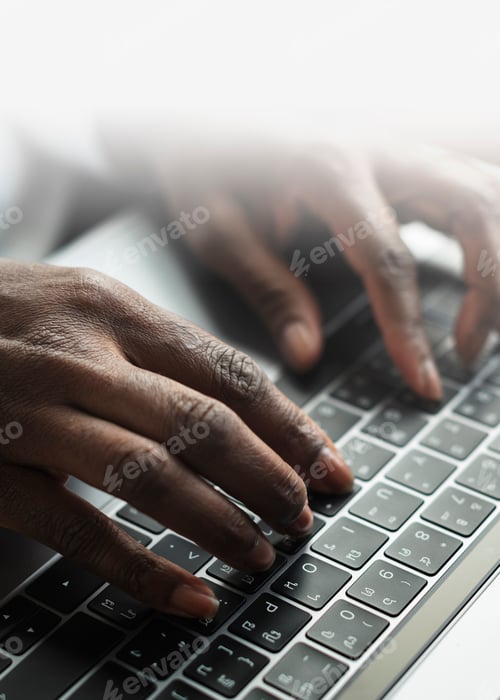 Preview: Woman typing on a laptop keyboard