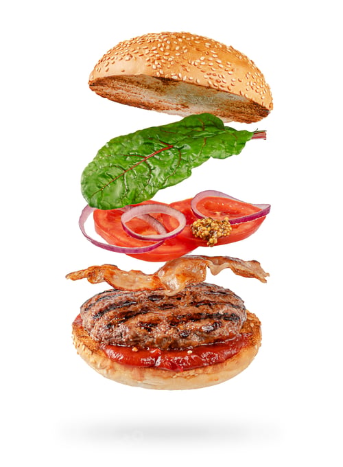 Preview: Flying hamburger with clipping path isolated on white background. Fast food