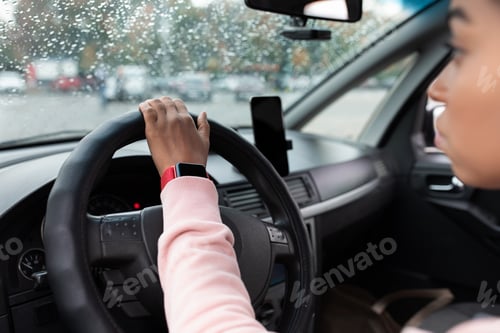 Preview: Modern driver with gadgets at work in auto