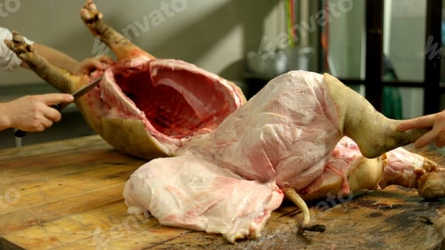 Preview: Carcass of freshly slaughtered pig at butchers workshop.