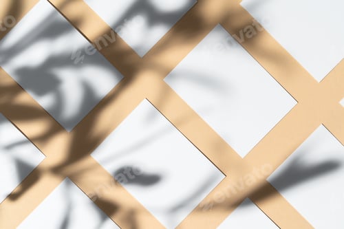 Preview: Blank white businesscard on beige background with creative floral shadow