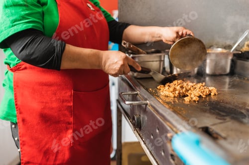 Preview: Chef cooking meat for tacos in a restaurant