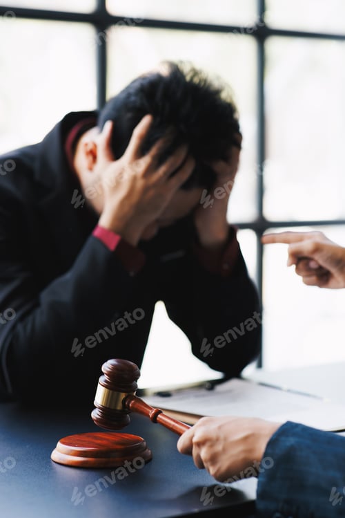 Preview: lawyer working with upset male client in office and talking with client who feel sad about consult