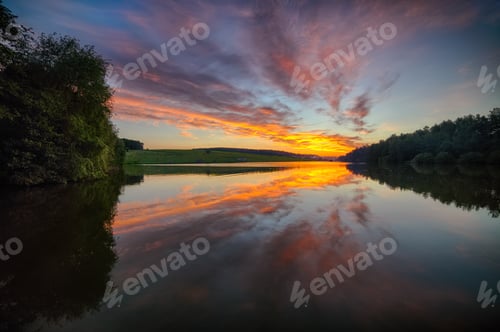 Preview: Amazing Dramatic sunset over the lake.
