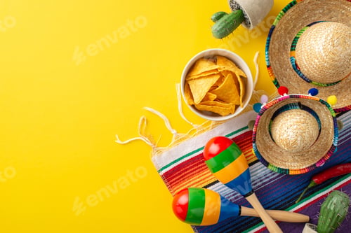Preview: Cinco de Mayo arrangement. Overhead perspective of traditional accessories: small-sized sombreros
