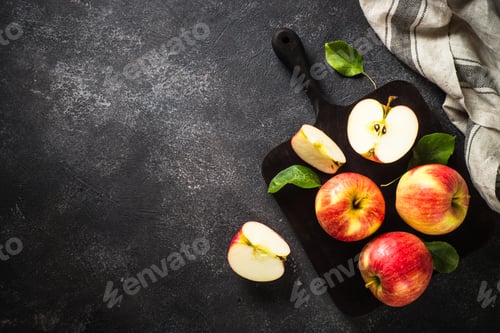Preview: Fresh ripe red apples in the basket at white table.