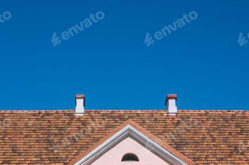 Preview: the roof of the house against the blue sky,