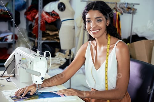 Preview: Dressmaker using sewing machine