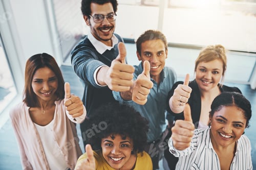 Preview: We believe in you. Portrait of a group of businesspeople showing thumbs up in an office.