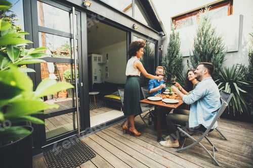 Preview: Cheerful young people have lunch in the courtyard and have a fun