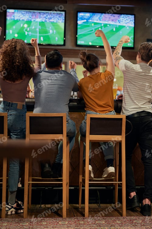 Preview: Cheering friends of soccer fans in the pub